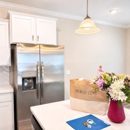 a kitchen with housewarming gifts on an island