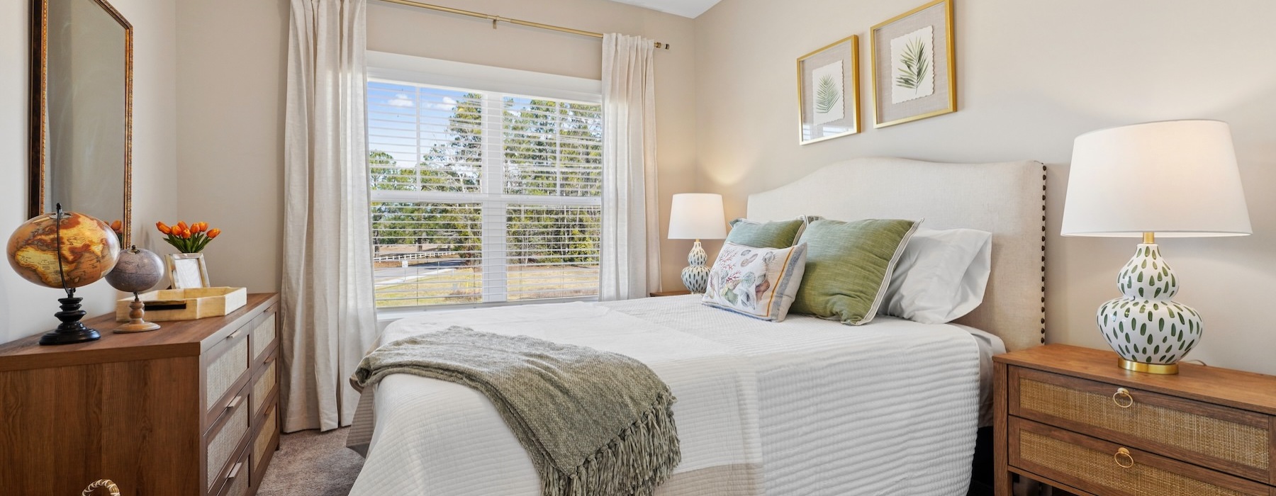 a bedroom with a bed and a fan